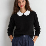 White Peter Pan collar dickey layered over black sweater, front view