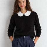 White Peter Pan collar dickey layered over black sweater, front view