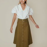 Olive green midi A-line skirt with gold buttons, belt, and patch pockets
