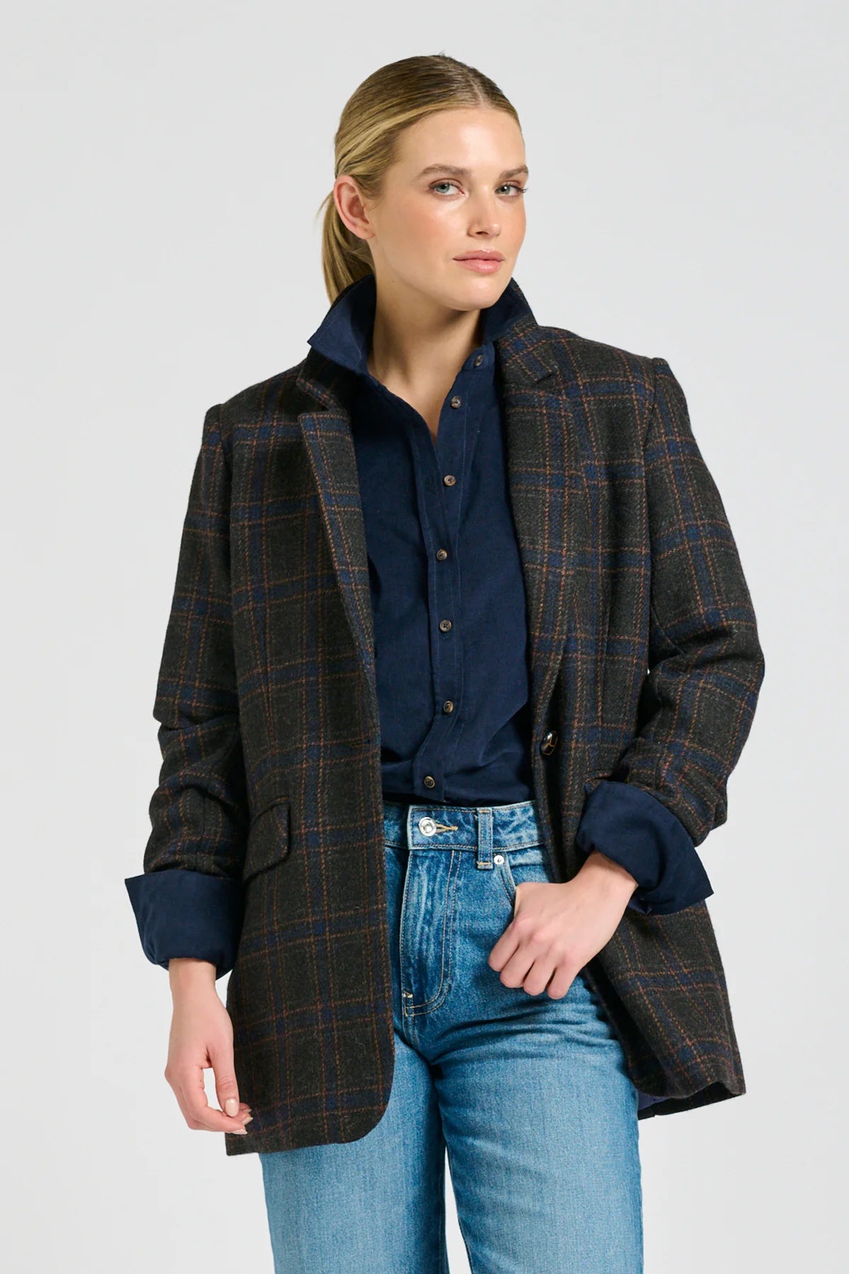 Dark plaid wool blend oversized blazer with blue and rust check pattern, longline fit