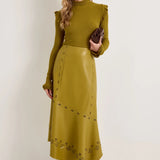 Olive green faux leather midi skirt with laser-cut floral detail and asymmetric hem