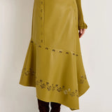 Olive green laser-cut leather midi skirt with asymmetric hem and floral perforations