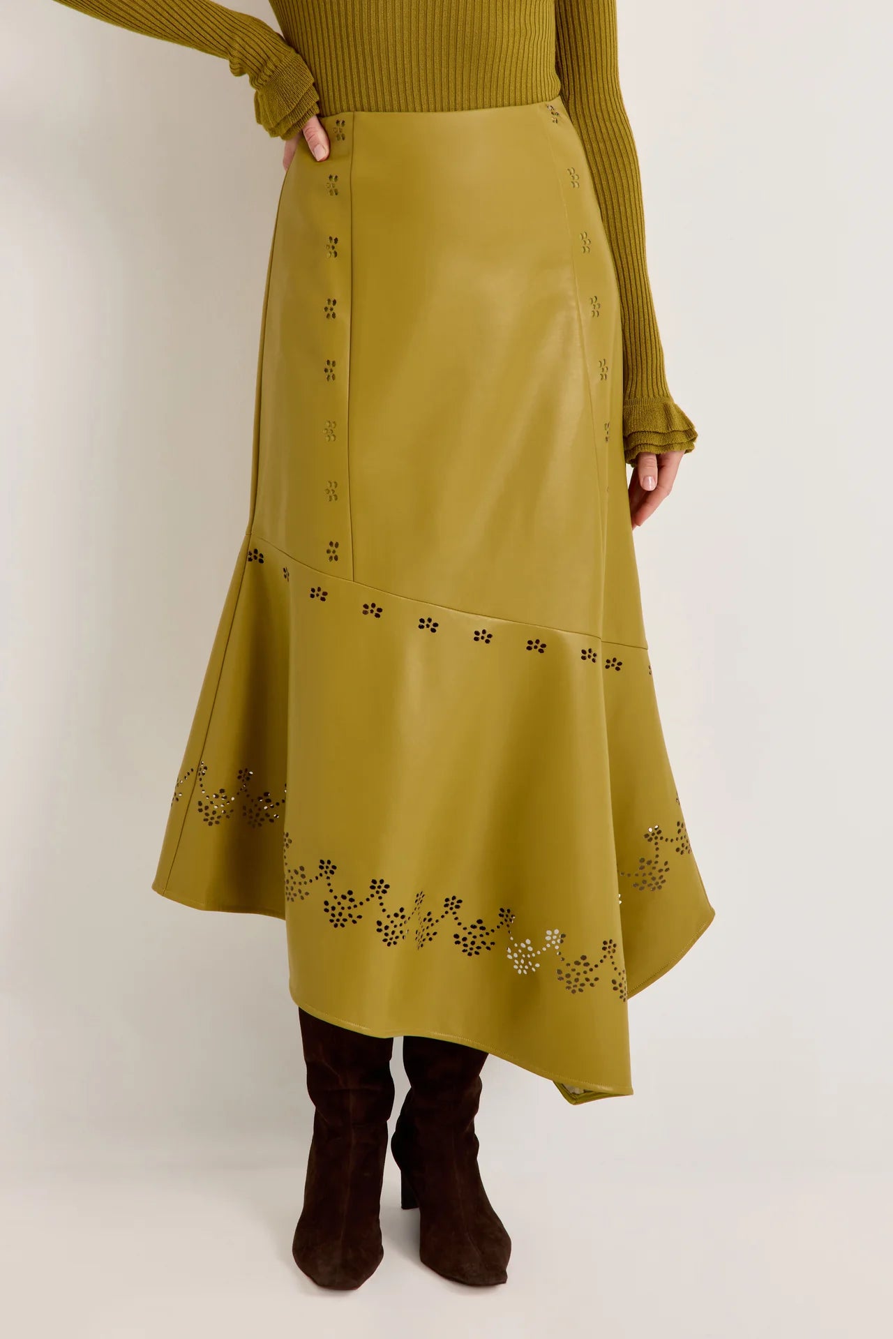 Olive green laser-cut leather midi skirt with asymmetric hem and floral perforations