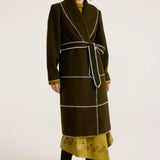 Olive green wool wrap coat with white blanket stitch trim and self-tie belt