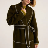 Olive green wool wrap coat with white contrast blanket stitching and self-tie belt