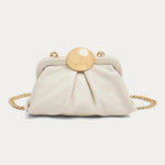Cream leather mini frame crossbody bag with gold circular clasp and chain strap