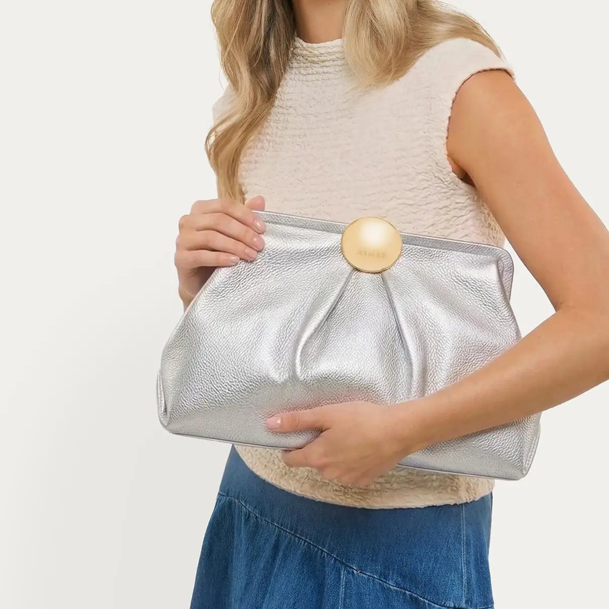 Aimee Full Circle XL silver metallic clutch bag with gold dome clasp