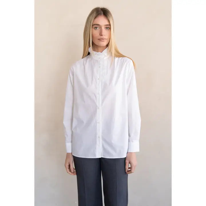 White long-sleeve button-front shirt with ruffle stand collar and wide cuffs