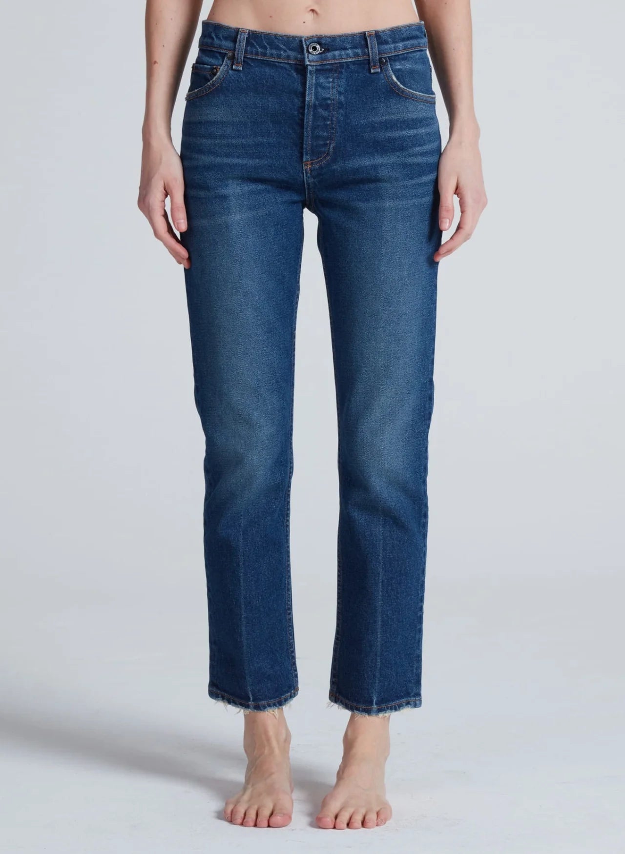 Women's high-rise slim straight medium blue wash cropped jeans with raw hem