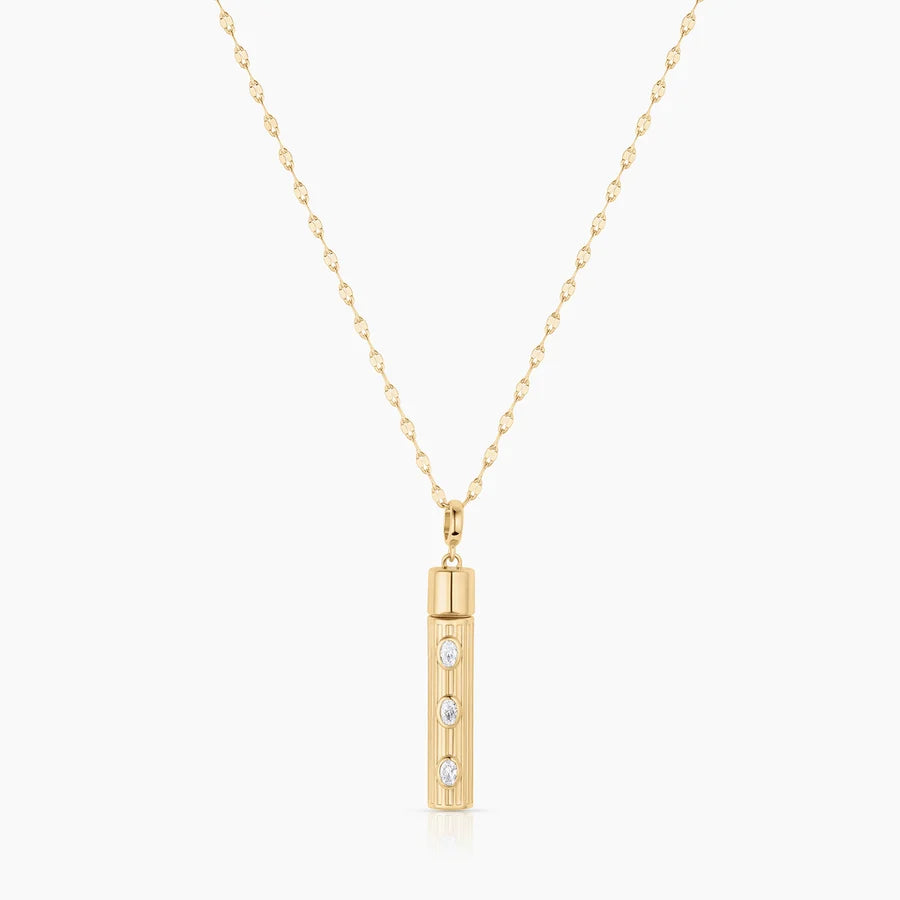 Gold bar capsule pendant necklace with three oval CZ stones on delicate chain