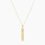 Gold bar capsule pendant necklace with three oval CZ stones on delicate chain