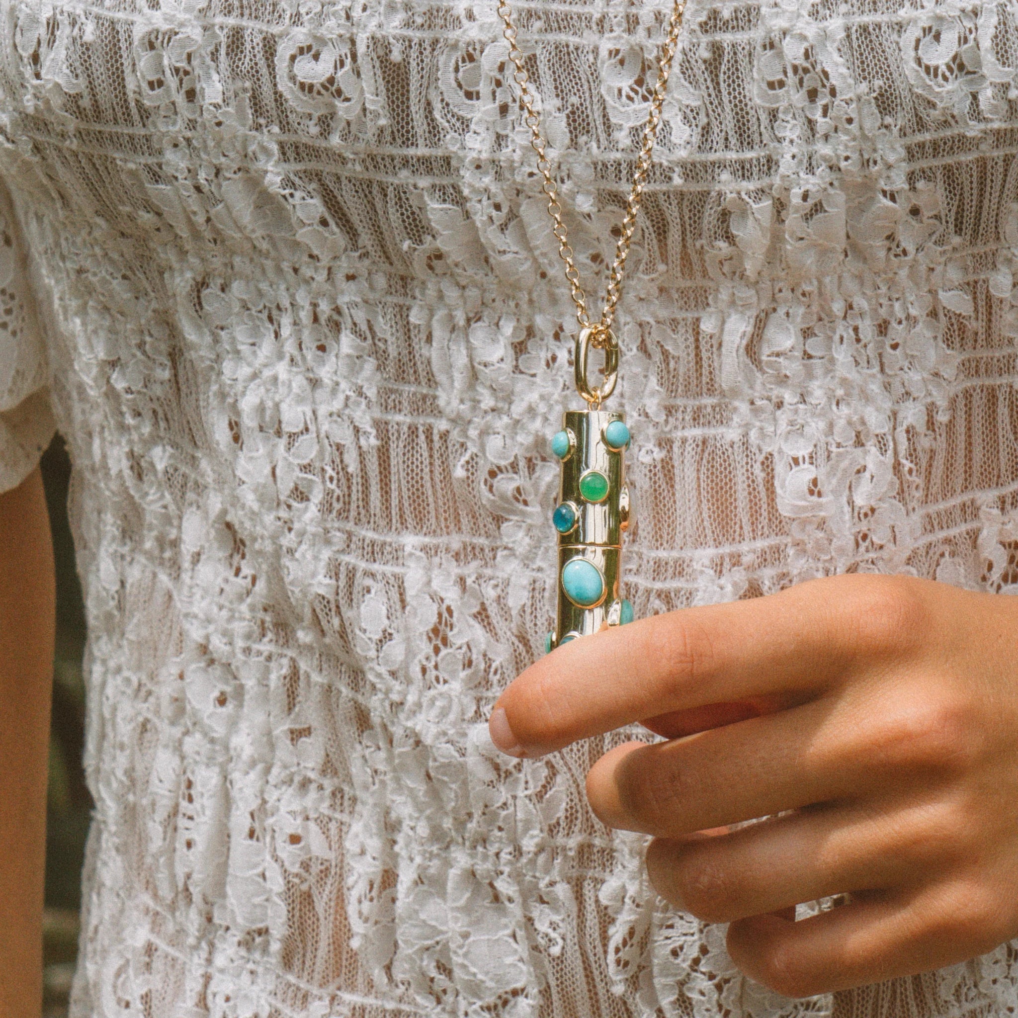Thatch Elio gold capsule pendant necklace with turquoise and green gemstones on chain