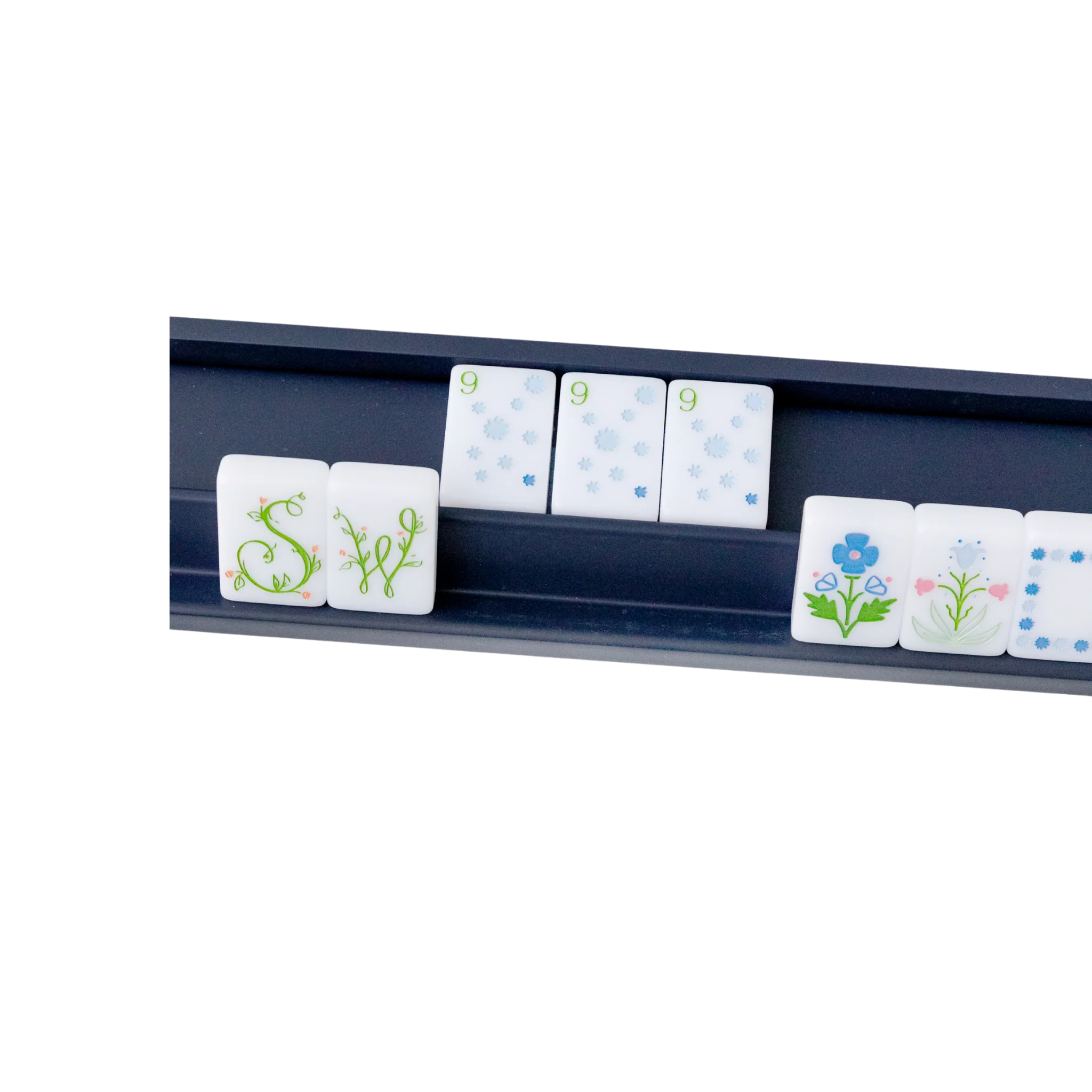 Navy blue mahjong tile rack holding floral and numbered white mahjong tiles