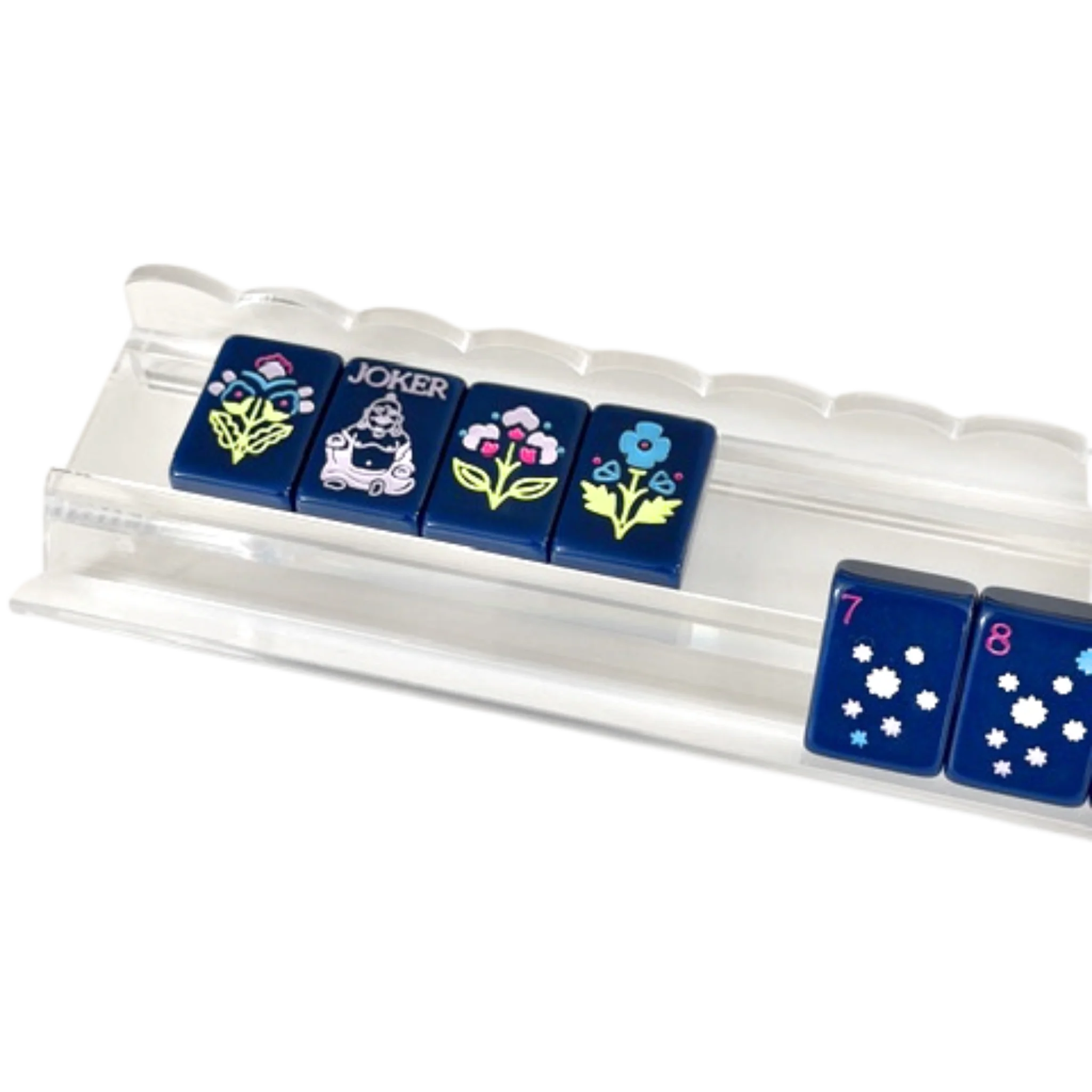 Clear acrylic scalloped mahjong rack holding navy blue floral and joker tiles