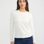 Wheat Cannes cream white long sleeve crew neck fitted shirt on model with dark jeans