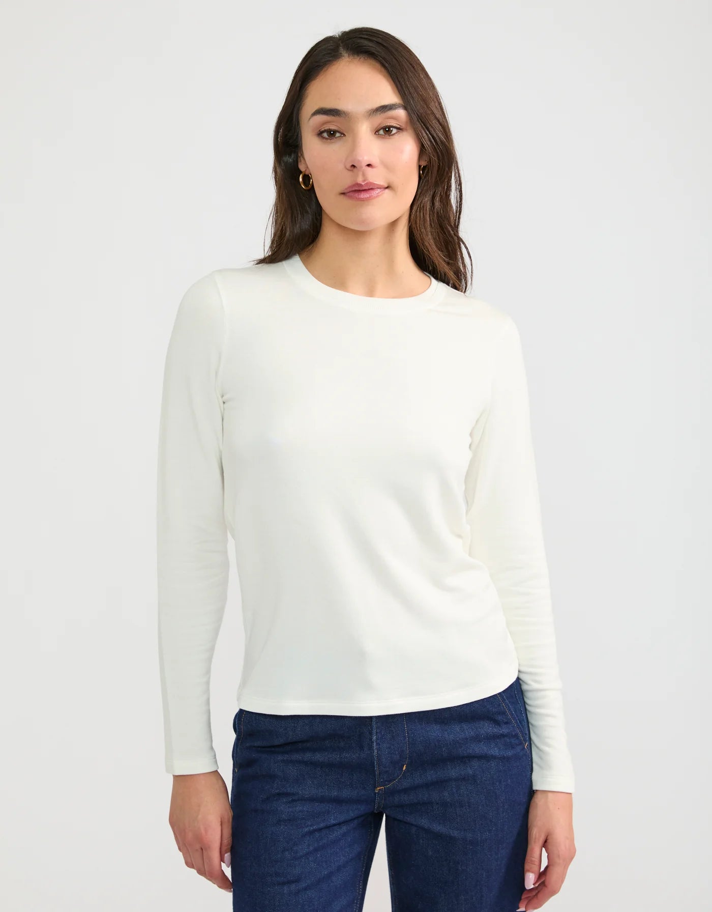 Wheat Cannes cream white long sleeve crew neck fitted shirt on model with dark jeans