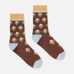 Brown crew socks with cactus floral print, yellow cuff, and light blue heel and toe
