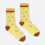 Yellow ribbed crew socks with floral pattern, brown heel, toe, and cuff stripe.