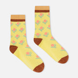 Yellow ribbed crew socks with floral pattern, brown heel, toe, and cuff stripe.