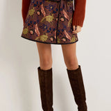 Brown floral jacquard mini wrap skirt with olive and blue botanical print