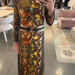 Black leather Doncello belt with gold hardware styled over paisley midi dress