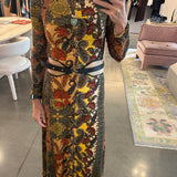 Black leather Doncello belt with gold hardware styled over paisley midi dress