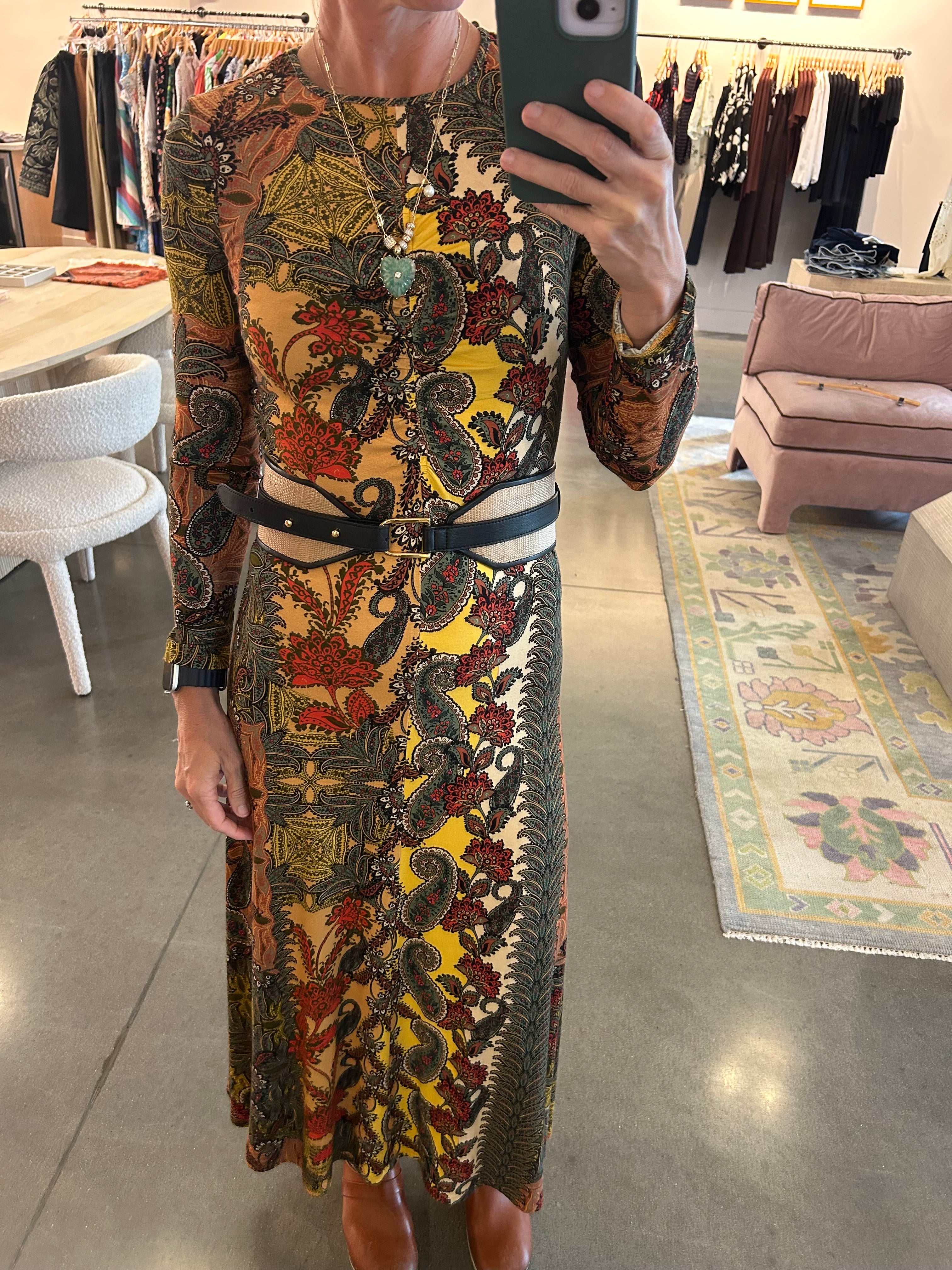 Black leather Doncello belt with gold hardware styled over paisley midi dress