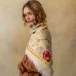 Cream cashmere wrap with colorful floral and bird paisley pattern, fringed edges