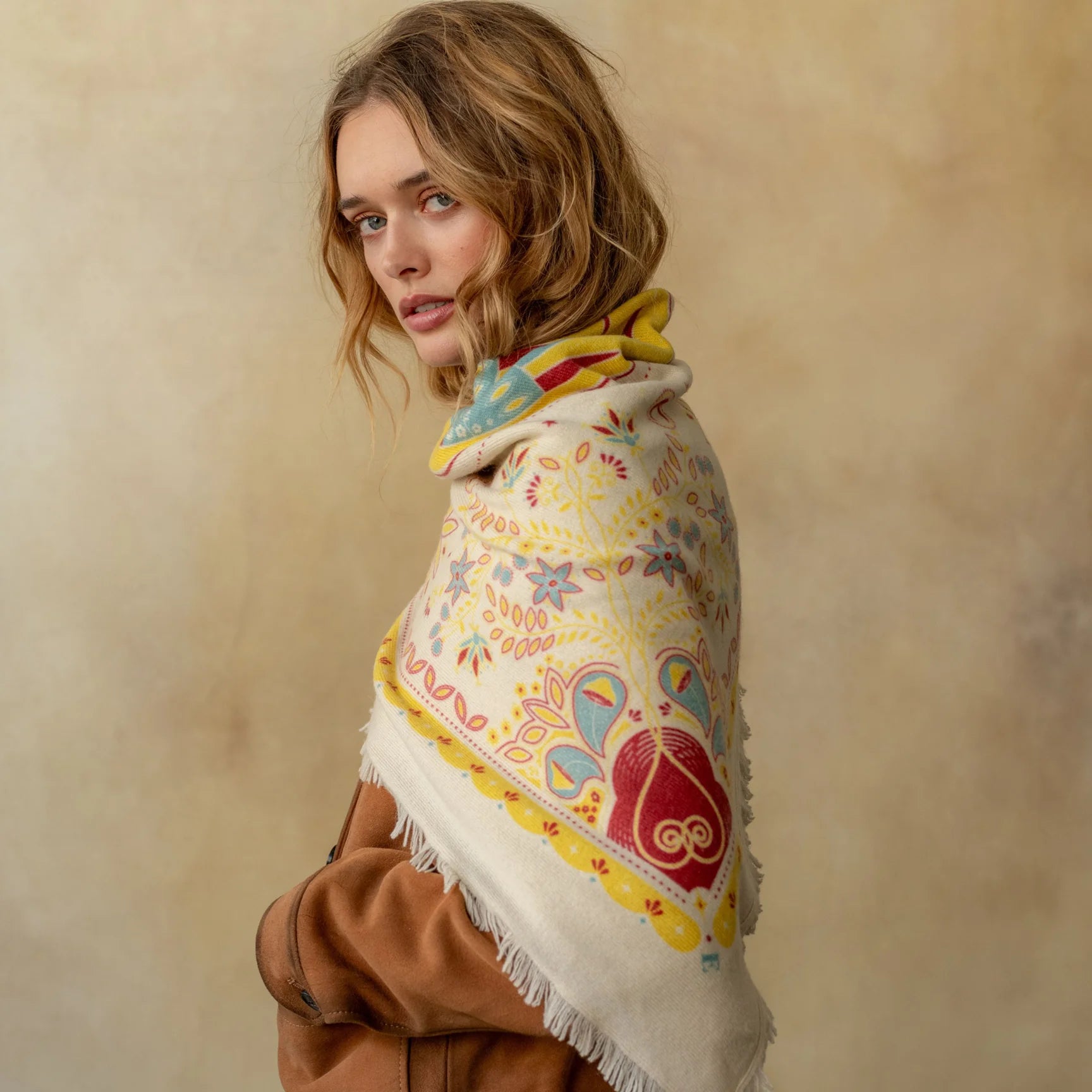 Cream cashmere wrap with colorful floral and bird paisley pattern, fringed edges