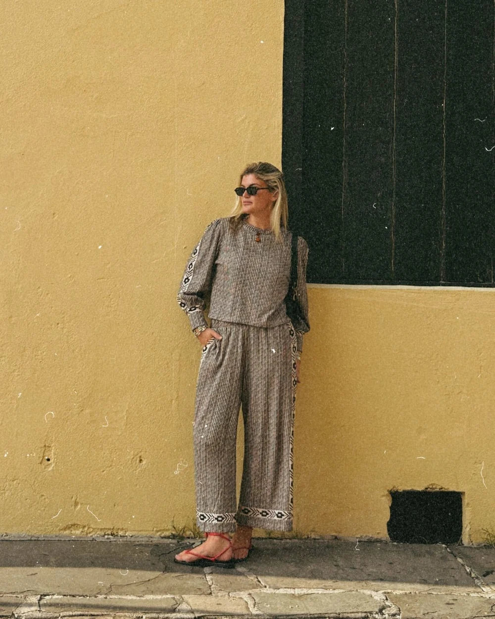 Wide-leg gray striped cotton sweatpants with geometric border trim and elastic waist
