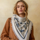 Cream cashmere bandana wrap with navy botanical and insect print, fringe edges
