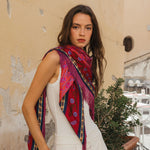 Red floral silk bandana scarf with pink fringe trim and geometric border