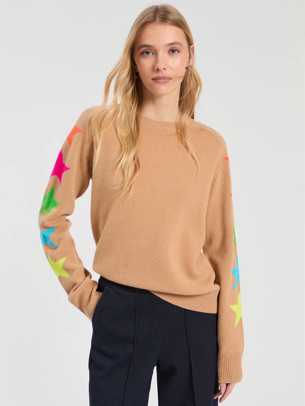 Camel knit sweater with multicolor neon star pattern along both sleeves